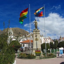 The Virgen de Copacabana with the Bolivan and Aymara flag